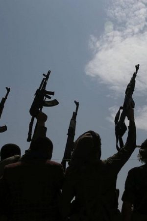 A silhouette of tribesmen loyal to Houthi rebels raise their weapons as they chant slogans during a gathering against the agreement to establish diplomatic relations between Israel and the United Arab Emirates in Sanaa, Yemen, Saturday, Aug. 22, 2020. (AP Photo/Hani Mohammed)/AHM113/20235448447765//2008221432